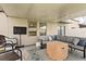 Covered patio featuring outdoor seating, TV and ceiling at 4704 Wild Senna Blvd, Tampa, FL 33619
