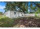 Spacious backyard featuring a white fence and lush green grass, perfect for outdoor activities at 6208 S Harold Ave, Tampa, FL 33616