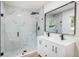 Modern bathroom features a double sink vanity and a large glass-enclosed shower at 6208 S Harold Ave, Tampa, FL 33616