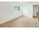 Bright and airy bedroom with ample natural light and new flooring at 6208 S Harold Ave, Tampa, FL 33616