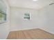 Bedroom featuring wood-look floors and a bright window at 6208 S Harold Ave, Tampa, FL 33616