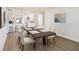 Open-concept dining room area with modern table set, adjacent to the kitchen at 6208 S Harold Ave, Tampa, FL 33616