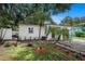 Charming home featuring a well-manicured lawn, quaint walkway, and one car garage at 6208 S Harold Ave, Tampa, FL 33616