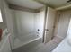 Bright bathroom featuring a tub and shower combination at 7240 Rosarian Dr, Port Richey, FL 34668