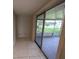 Living room showing sliding glass doors to an outdoor porch at 7240 Rosarian Dr, Port Richey, FL 34668