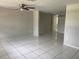 Spacious living room featuring tile floors, ceiling fan, and neutral paint at 7240 Rosarian Dr, Port Richey, FL 34668