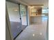 Open-concept space featuring kitchen, dining area, and living room with tile flooring at 7240 Rosarian Dr, Port Richey, FL 34668