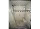 Shower featuring black and white tile, a built in bench, and a shower head at 26627 Brahma Dr, Wesley Chapel, FL 33544