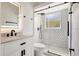 Modern bathroom featuring black fixtures, a glass-enclosed shower, and a vanity with marble countertop at 11019 Pine Lilly Pl, Lakewood Ranch, FL 34202