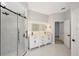 Modern bathroom with a walk-in shower and double vanity at 11019 Pine Lilly Pl, Lakewood Ranch, FL 34202