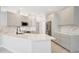 Modern kitchen featuring sleek countertops, stainless steel appliances, and minimalist cabinetry at 11019 Pine Lilly Pl, Lakewood Ranch, FL 34202
