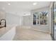 Open-concept room with hard-wood flooring and lots of natural light at 11019 Pine Lilly Pl, Lakewood Ranch, FL 34202
