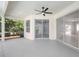 Large covered patio with ample space for outdoor living and a view of the backyard and pool at 11019 Pine Lilly Pl, Lakewood Ranch, FL 34202