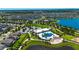 Overhead view of community clubhouse with a pool and amenity center surrounded by lush landscaping at 11124 Leland Groves Dr, Riverview, FL 33579