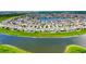 Extensive aerial view of houses surrounding lake. in a planned community at 11124 Leland Groves Dr, Riverview, FL 33579