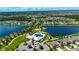An aerial shot highlighting the community amenities including a pool and playground by the lake at 11124 Leland Groves Dr, Riverview, FL 33579