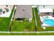 Aerial of a backyard featuring a lawn, garden, and private pool at 11124 Leland Groves Dr, Riverview, FL 33579