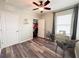 Comfortable bedroom featuring wood-look flooring, closet and natural light, a great flexible space at 11124 Leland Groves Dr, Riverview, FL 33579
