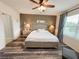 Bright bedroom featuring a ceiling fan and a window providing natural light at 11124 Leland Groves Dr, Riverview, FL 33579
