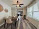 Stylish dining room featuring a modern table, chairs, decorative accents, and lots of natural light at 11124 Leland Groves Dr, Riverview, FL 33579