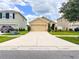Suburban single Gathering home with an attached garage and a long driveway at 11124 Leland Groves Dr, Riverview, FL 33579