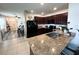 Spacious kitchen featuring granite countertops, stainless steel sink, and dark wood cabinets at 11124 Leland Groves Dr, Riverview, FL 33579