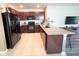 Beautiful kitchen featuring stainless steel appliances and a granite countertop breakfast bar at 11124 Leland Groves Dr, Riverview, FL 33579