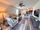 An open concept floor plan that connects the living room, dining room, and kitchen at 11124 Leland Groves Dr, Riverview, FL 33579
