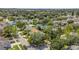 Expansive aerial shot of suburban neighborhood with mature trees, landscaping and a lake at 1236 Sweet Gum Dr, Brandon, FL 33511