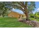 Lush backyard with large tree providing shade and outdoor living space at 1236 Sweet Gum Dr, Brandon, FL 33511