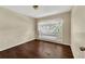 Bedroom with wood-look floors and a large window, creating a bright and airy space at 1236 Sweet Gum Dr, Brandon, FL 33511