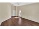 A bedroom featuring vaulted ceilings and a neutral color palette, complete with dark hardwood floors at 1236 Sweet Gum Dr, Brandon, FL 33511
