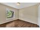 Bedroom with wood-look floors, window, and closet providing a comfortable living space at 1236 Sweet Gum Dr, Brandon, FL 33511