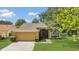 Charming single-story home featuring a well-manicured lawn and attached two car garage at 1236 Sweet Gum Dr, Brandon, FL 33511