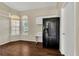 Bright kitchen with breakfast nook, black refrigerator and laminated flooring at 1236 Sweet Gum Dr, Brandon, FL 33511