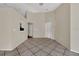 Living area featuring tile floors, neutral walls, and passthrough to kitchen at 1236 Sweet Gum Dr, Brandon, FL 33511