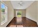 Bright living room with hardwood floors and sliding glass doors to the backyard at 1236 Sweet Gum Dr, Brandon, FL 33511