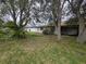 Home exterior showcasing backyard and greenery at 13382 Drummond Ave, Port Charlotte, FL 33953
