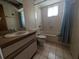 A full bathroom with a shower-tub combo and single sink at 13382 Drummond Ave, Port Charlotte, FL 33953