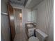 This bathroom features a single sink and toilet at 13382 Drummond Ave, Port Charlotte, FL 33953