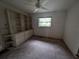 This bedroom features built-in shelves and cabinets, offering ample storage space at 13382 Drummond Ave, Port Charlotte, FL 33953