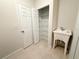 Utility sink is near shelving in this modern laundry room, allowing for easy organization and cleaning at 5079 Fairlane Dr, North Port, FL 34288