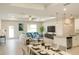 Open-concept living space with eat in kitchen, modern furnishings, and ample natural light at 5079 Fairlane Dr, North Port, FL 34288
