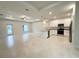 Spacious, open-concept living space blends the living and kitchen areas, featuring ample natural light at 5079 Fairlane Dr, North Port, FL 34288