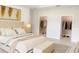 Spacious main bedroom with a luxurious king bed and dual walk-in closets, offering ample storage at 5079 Fairlane Dr, North Port, FL 34288