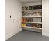 Organized storage room featuring multiple shelves filled with tools, enhancing functionality and accessibility at 5079 Fairlane Dr, North Port, FL 34288