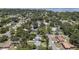 Scenic aerial view of a charming neighborhood with tree-lined streets, showcasing well-maintained homes and lush landscaping at 707 63Rd S Ave, St Petersburg, FL 33705
