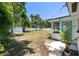 Expansive backyard featuring a storage shed, white fencing, and lush greenery for outdoor activities at 707 63Rd S Ave, St Petersburg, FL 33705
