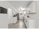 Modern kitchen featuring white cabinets, stainless steel appliances, and subway tile backsplash at 707 63Rd S Ave, St Petersburg, FL 33705