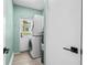 Laundry room with stackable washer/dryer and ample space, leading to an exit door for convenience at 707 63Rd S Ave, St Petersburg, FL 33705